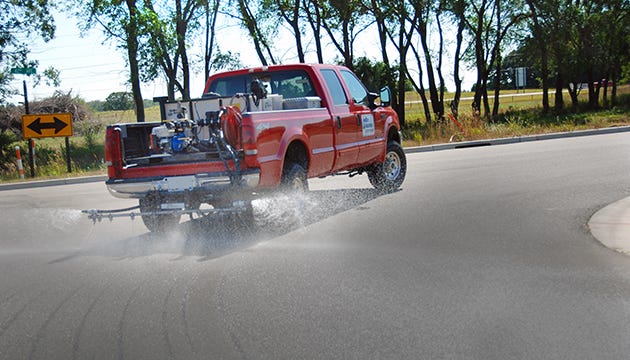 contractor truck spraying salt brine